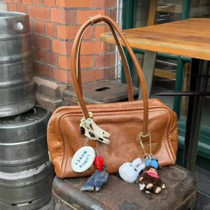 折上8折！蝴蝶结机车包$372