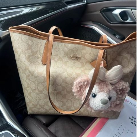 City Tote In Signature Canvas City  $490.00  |