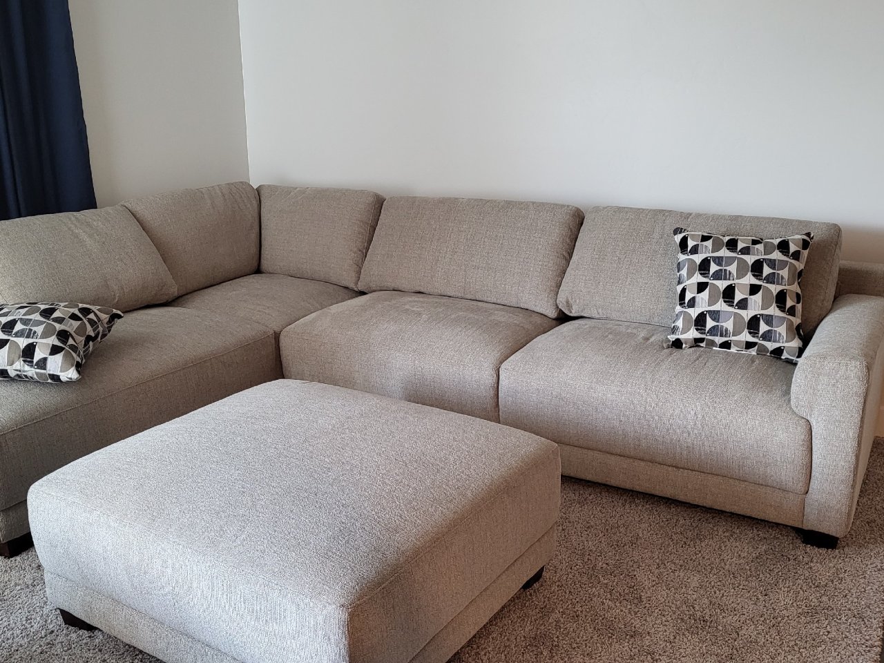 Raylin Fabric Sectional with Ottoman | Costco