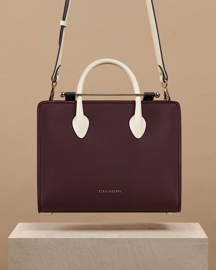 1663074822-strathberry_thestrathberrymidtote_burgundynavyvanilla_700x