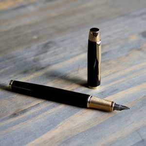 Parker IM Fountain Pen, Black Lacquer Gold Trim, Fine Nib with Blue Ink Refill