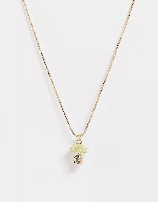 necklace with green mushroom pendant in gold tone