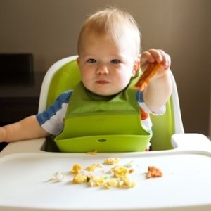 OXO Tot Waterproof Silicone Roll Up Bib with Comfort-Fit Fabric Neck