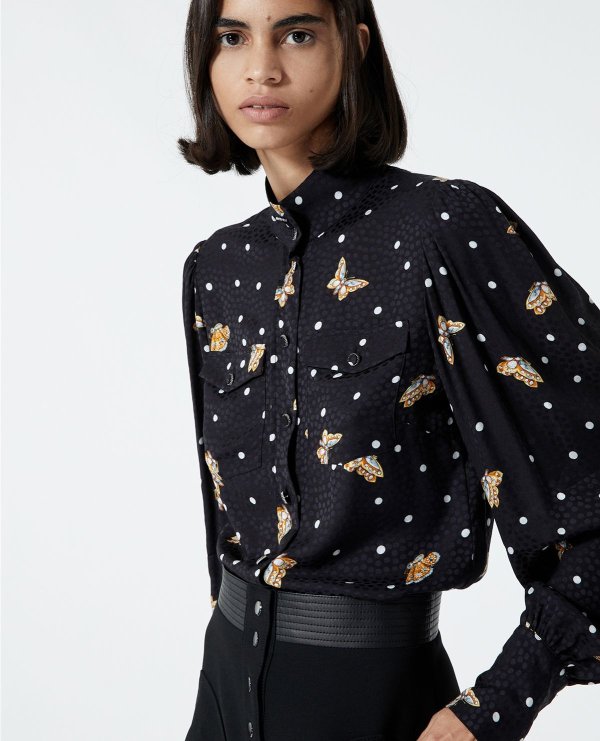 Printed black shirt with high neck.