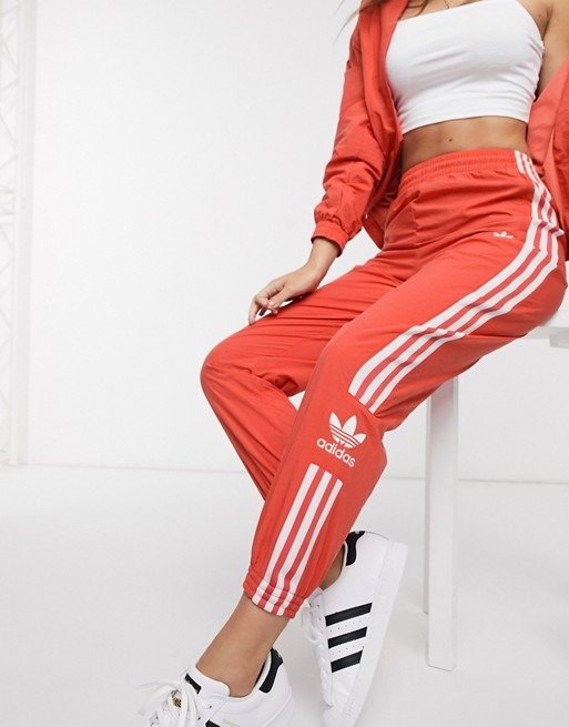 adicolor locked up logo track pants in red 