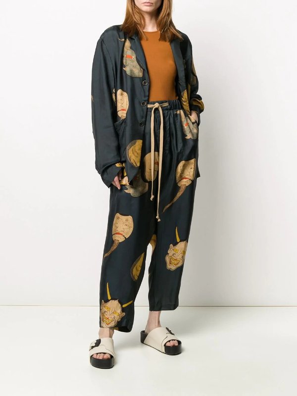drawstring printed faces trousers