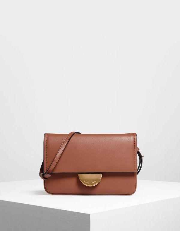 Cognac Metallic Accent Push Lock Pouch | CHARLES & KEITH US