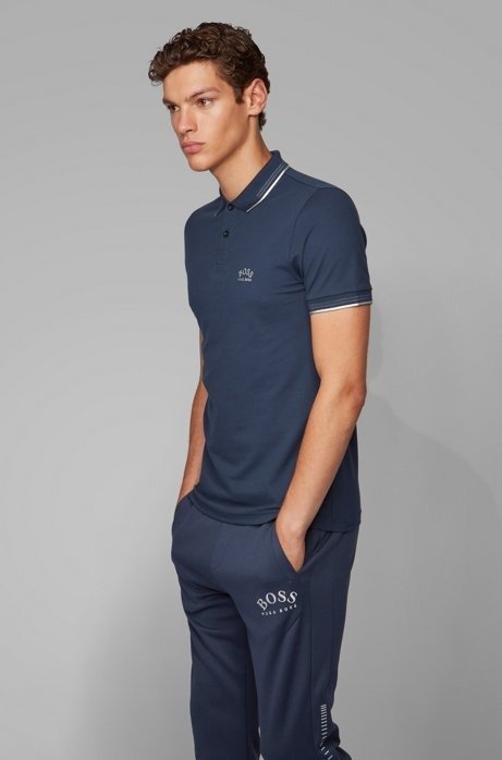 - Slim-fit polo shirt in stretch pique with curved logo
