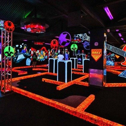 Four Passes for Indoor Glow-In-The-Dark Rockin' Mini Golf at KISS by Monster Mini Golf (Up to 49% Off)