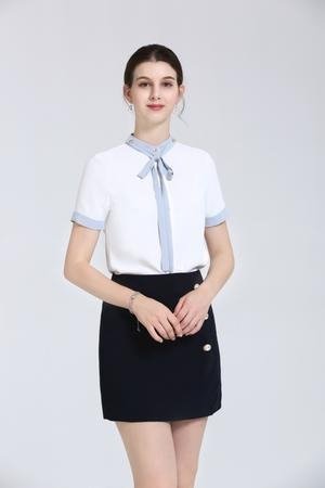White Blouse With Light Blue Tie At Neck