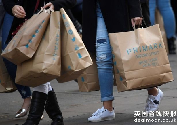 Shoppers-carry-Primark-bags-in-central-London-Britain
