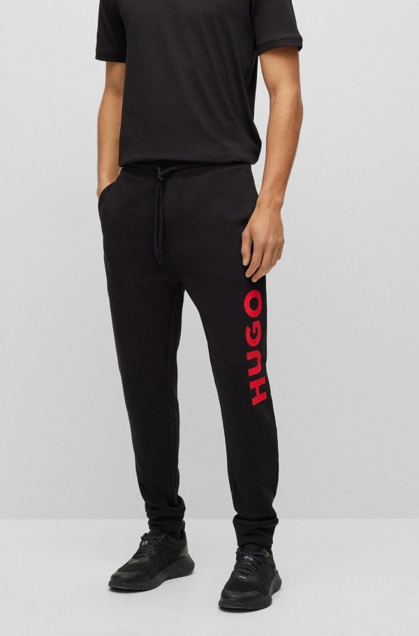 Cuffed tracksuit bottoms in French terry with contrast logo Cotton-jersey regular-fit T-shirt with contrast logo by HUGO Regular-fit cotton T-shirt with red logo label by HUGO Zip-through sweatshirt in terry cotton with logo patch by HUGO Mesh-upper trainers with decorative reflective details by HUGO