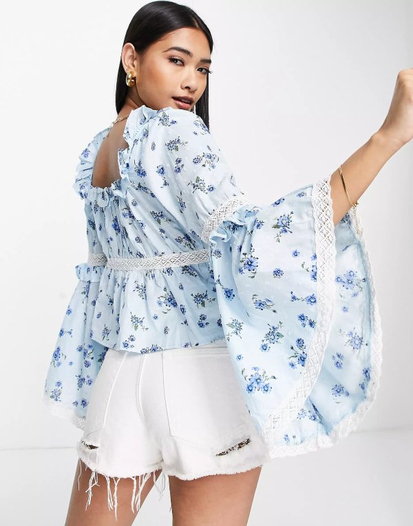 ASOS DESIGN ruffle neck top with lace trim detail and flared cuffs in blue floral