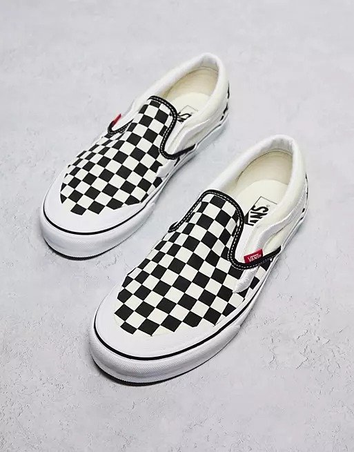Classic slip on in checkerboard print in white and black with white stripe