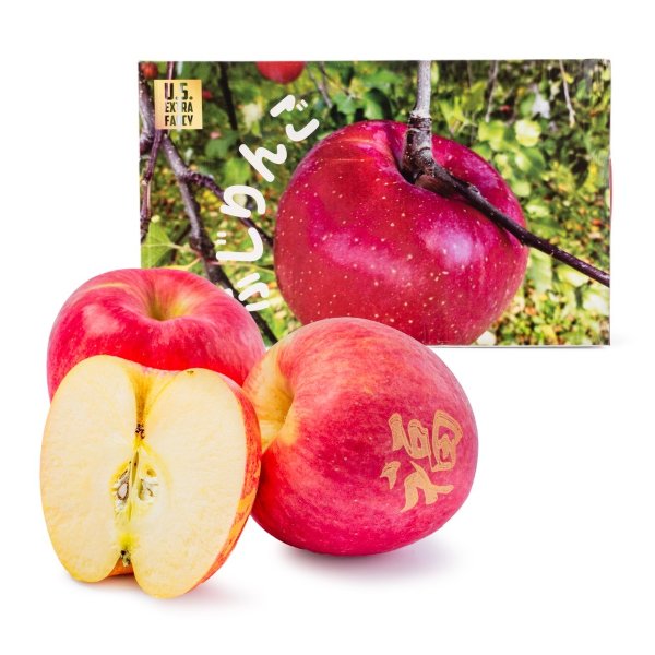 A box of fresh apples with the word "Fu"