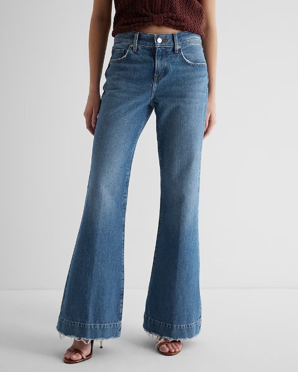 Mid Rise Medium Wash Raw Hem '70s Flare Jeans