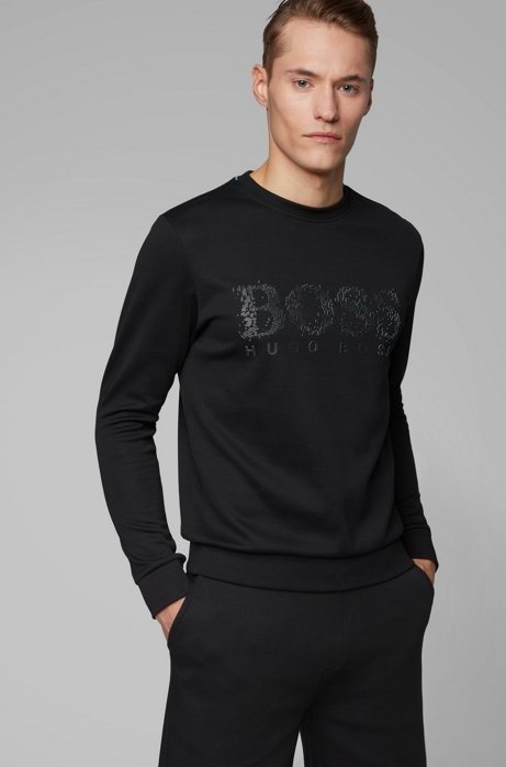 - Slim-fit sweatshirt with seasonal logo artwork