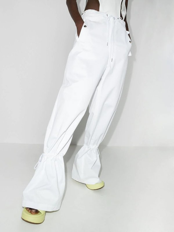 Eyelet tie-cuff flared trousers