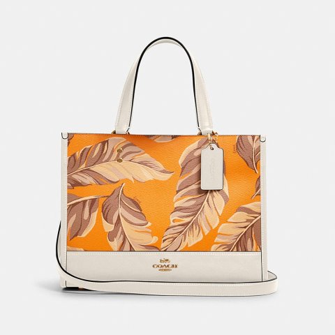 anna foldover crossbody clutch with banana leaves print