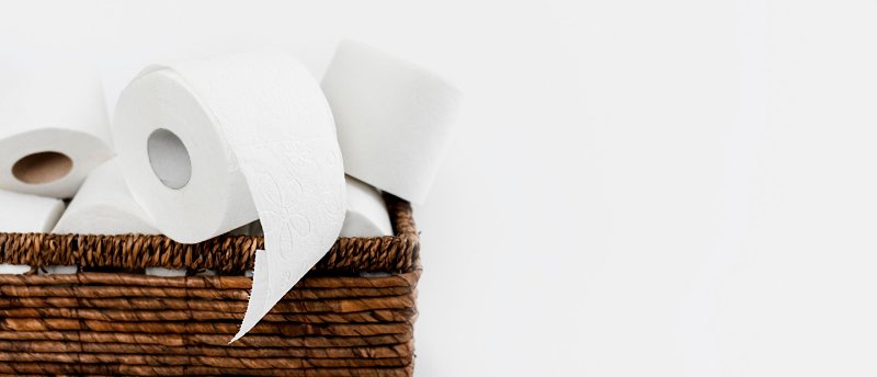 backet-with-toilet-paper-rolls-copy-space