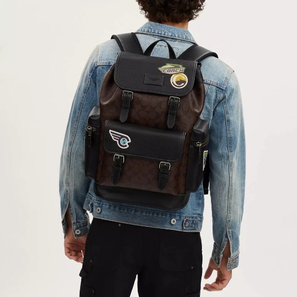 sprint backpack in signature canvas with travel patches