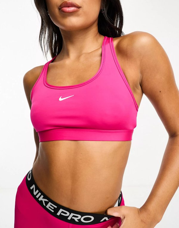 Swoosh Dri-FIT light support sports bra in fireberry pink