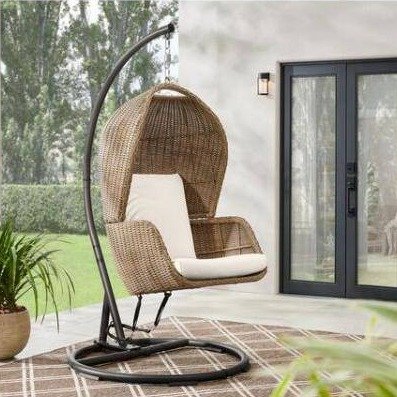 Melrose Park Brown Closed Wicker Outdoor Patio Egg Swing Close with CushionGuard Almond Biscotti Cushions