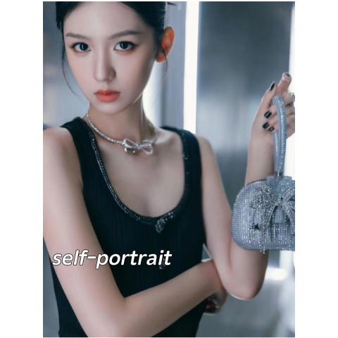Crystal-embellished bow tennis necklace